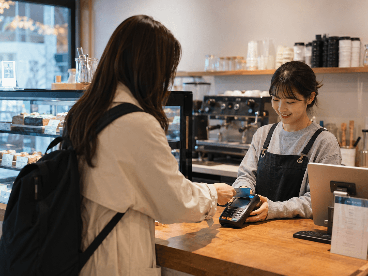 Traveler paying by credit card at a cafe in South Korea