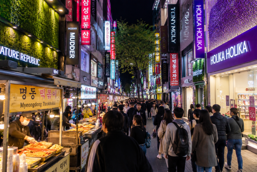 Crowded shopping street in Myeongdong Seoul at night