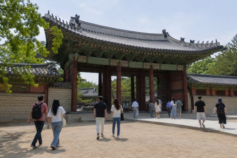 Visitors entering Changdeokgung Palace through Donhwamun Gate in Seoul