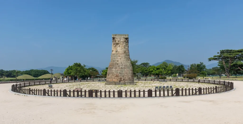 Cheomseongdae Observatory and its stonework under a blue sky in Gyeongju